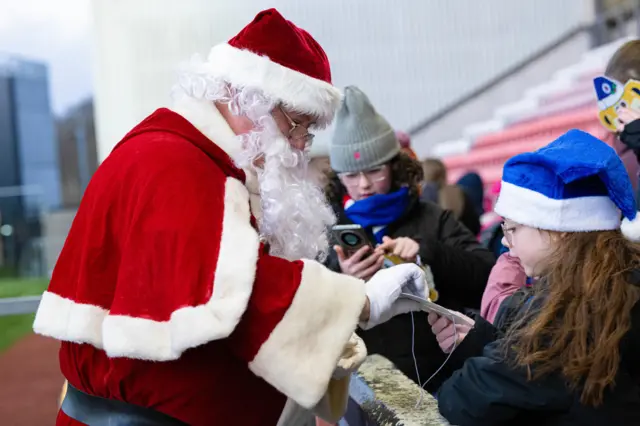 Santa with fans at Broadwood