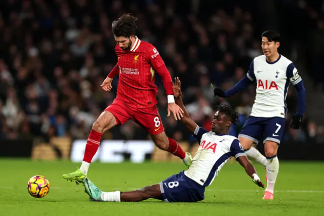 Dominik Szoboszlai of Liverpool is challenged by Yves Bissouma