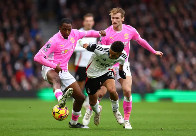 Joshua King of Fulham (C) in action whilst under pressure from Joe Aribo