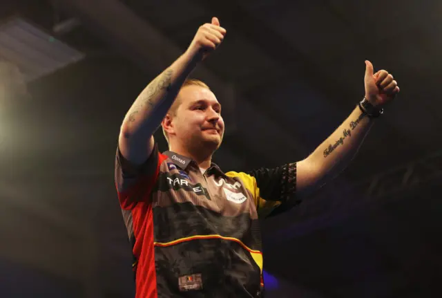 Dimitri Van den Bergh puts his thumb up to the crowd