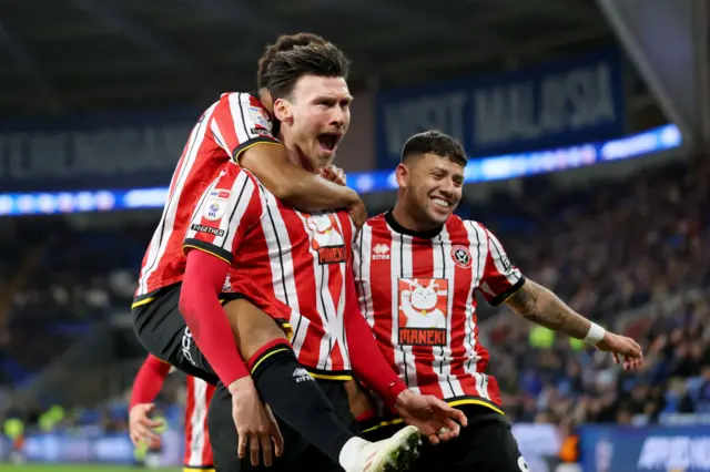 Sheffield United players celebrating scoring against Cardiff City