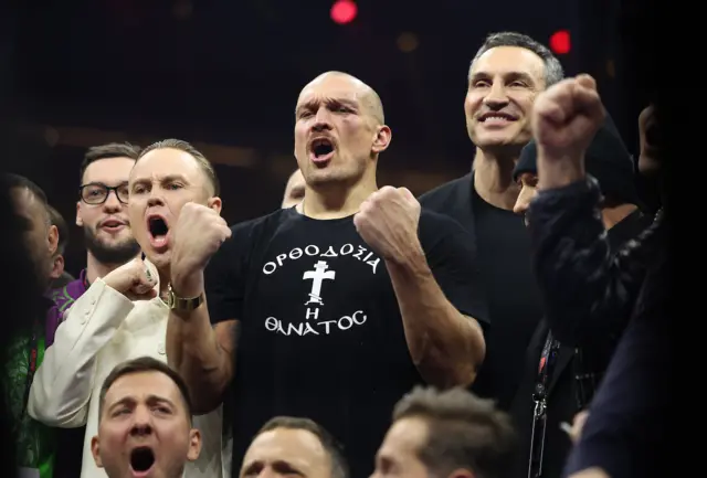 Oleksandr Usyk holds up his fists