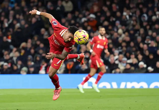 Luis Diaz heads the ball