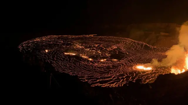 Lava erupts from vents on the west part of the caldera wall, feeding lava flows that cover the area of Halemaʻumaʻu crater