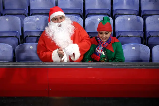 Crystal Palace fans dressed as Santa and an Elf during Saturday's game against Arsenal