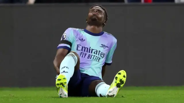 Arsenal's Bukayo Saka on the floor injured against Crystal Palace