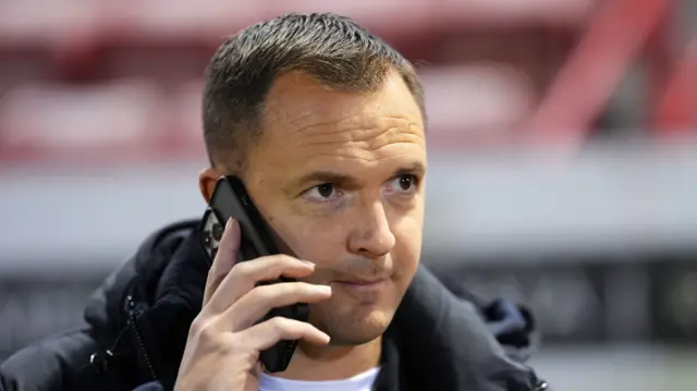 Birmingham manager Chris Davies on the phone