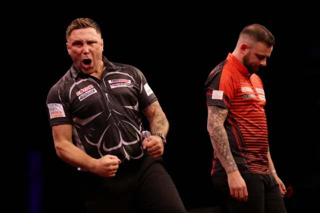 Gerwyn Price celebrates as Joe Cullen looks on
