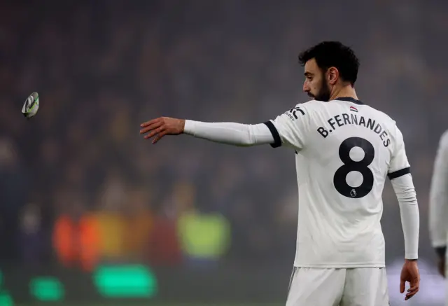 Manchester United's Bruno Fernandes throws the captain armband after being shown a red card