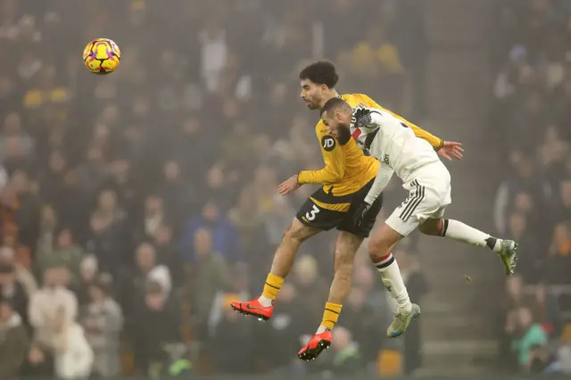 Rayan Ait-Nouri of Wolverhampton Wanderers and Noussair Mazraoui of Manchester United battle for a header