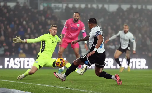 Derby's Nathaniel Mendez-Laing attempts a cross