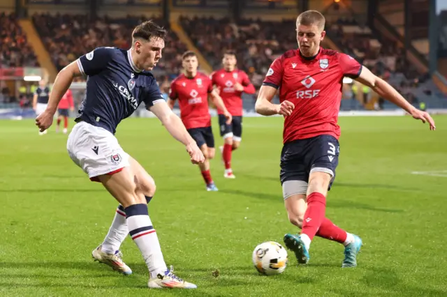 Josh Mulligan plays the ball off Ryan Leak