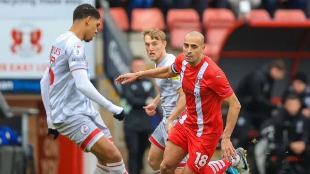 Leyton Orient midfielder Darren Pratley closes down Crawley's Tyreece John-Jules