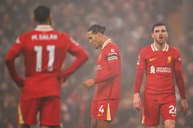 Liverpool players look on