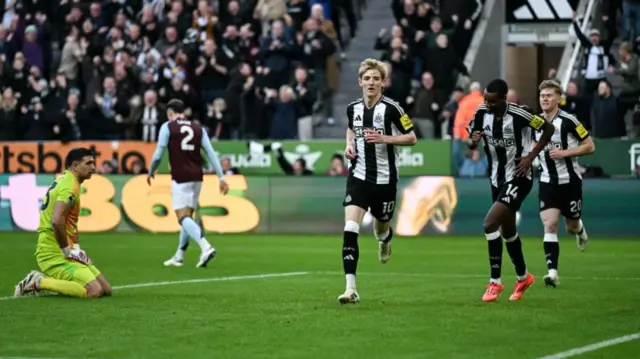 Anthony Gordon of Newcastle United turns to celebrate after scoring