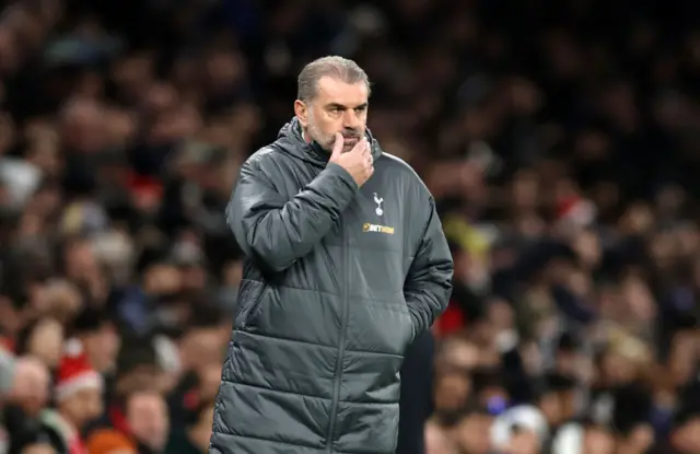 Ange Postecoglou with his hand on his chin