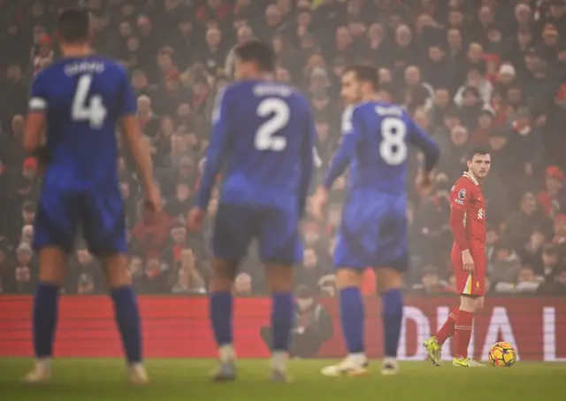 Andrew Robertson of Liverpool looks on