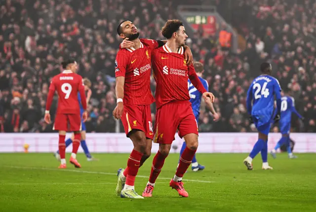 Cody Gakpo of Liverpool and teammate Curtis Jones react