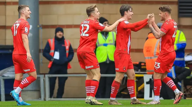 Leyton Orient goalscorer Charlie Kelman (right) celebrates with team-mates after scoring against Crawley