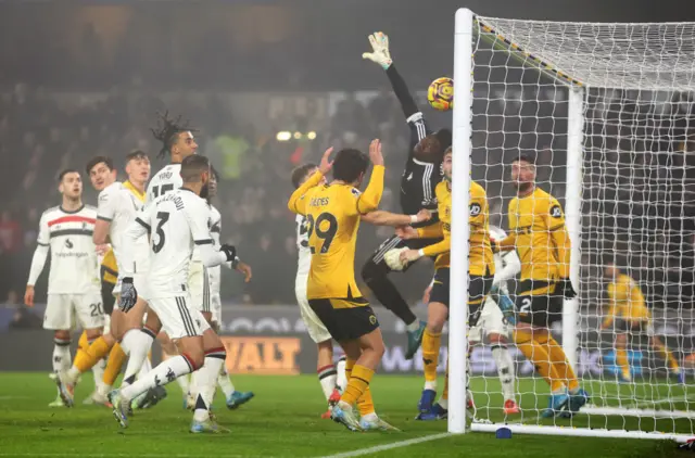 Matheus Cunha of Wolverhampton Wanderers scores his team's first goal past Andre Onana of Manchester United from a corner kick