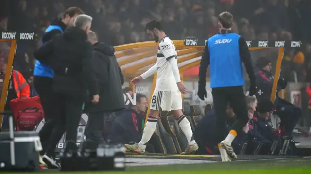 Manchester United's Bruno Fernandes heads down the tunnel after being sent off