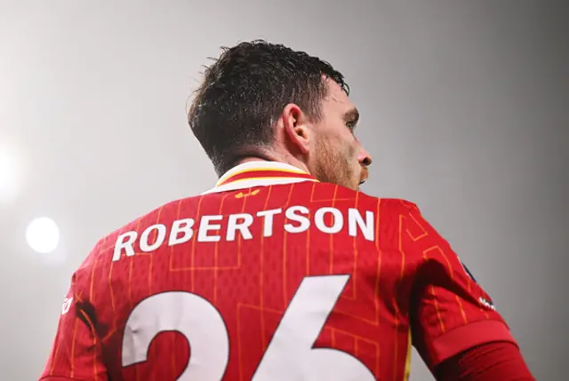 Andrew Robertson of Liverpool looks on