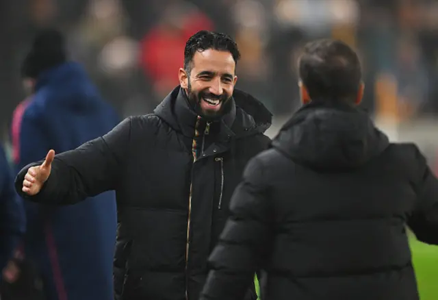 Ruben Amorim, Manager of Manchester United, embraces Vitor Pereir