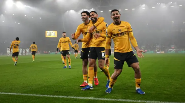 Matheus Cunha of Wolverhampton Wanderers celebrates scoring his team's first goal with teammates