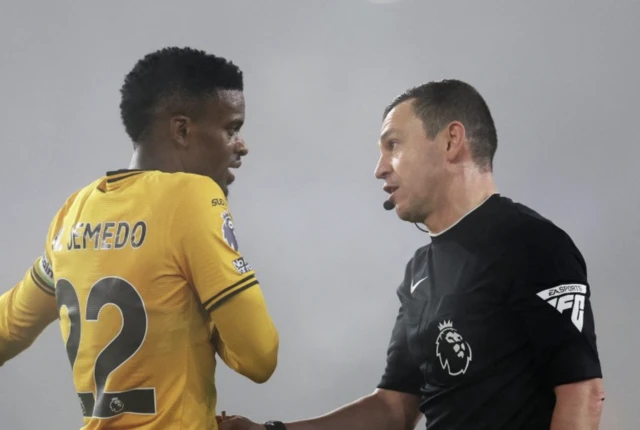 Wolverhampton Wanderers' Nelson Semedo talks to referee Tony Harrington