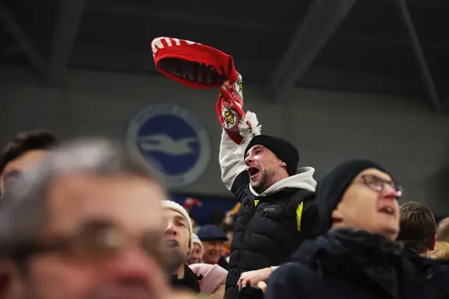 A Brentford fan celebrates