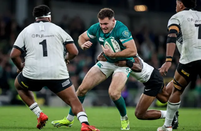 Jacob Stockdale is tackled against Fiji