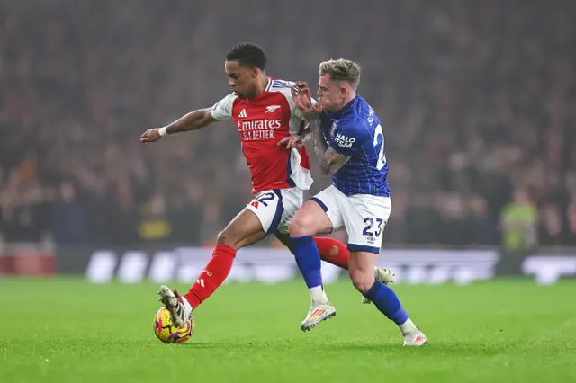 Jurrien Timber of Arsenal and Sammie Szmodics of Ipswich Town