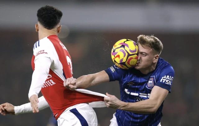 Arsenal's William Saliba in action with Ipswich Town's Liam Delap