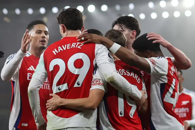 Fog surrounds the floodlights at The Emirates stadium as Arsenal celebrate