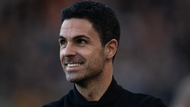 Mikel Arteta smiles