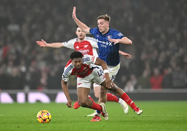 Myles Lewis-Skelly of Arsenal is fouled by Liam Delap