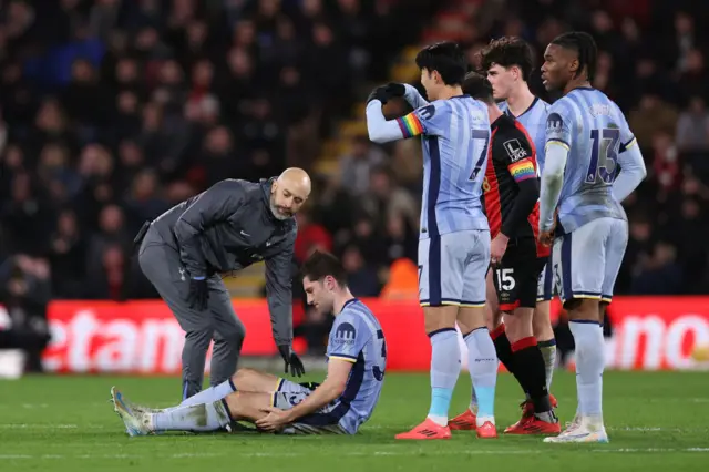 Ben Davies receiving treatment