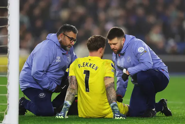 Mark Flekken of Brentford receives medical treatment