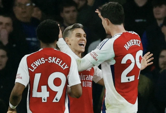 Arsenal's Kai Havertz celebrates scoring their first goal with Leandro Trossard