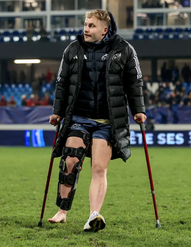 Craig Casey on crutches