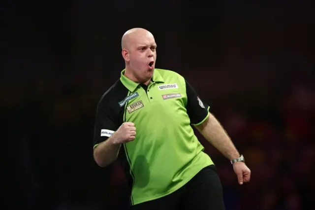 Michael van Gerwen celebrates winning the second set against Brendan Dolan