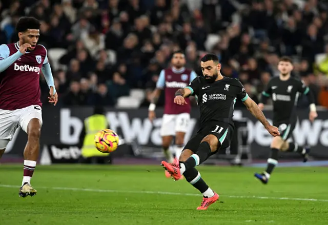 Mohamed Salah of Liverpool takes a shot