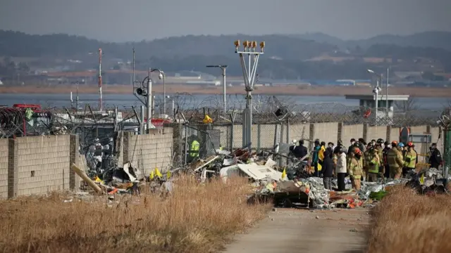 Rescue workers take part in a salvage operation at the site where an aircraft crashed after it went off the runway at Muan International Airport, in Muan, South Korea, December 29, 2024.