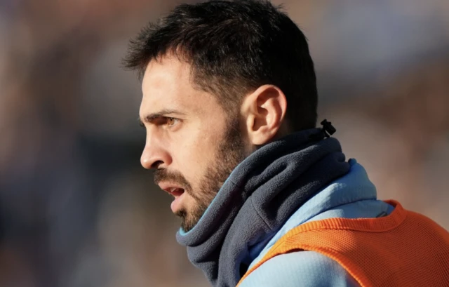 Manchester City's Bernardo Silva warms up