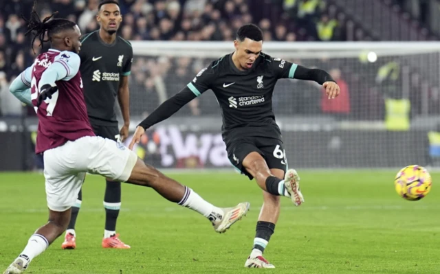 Liverpool's Trent Alexander-Arnold (right) and West Ham United's Aaron Wan-Bissaka battle for the ball