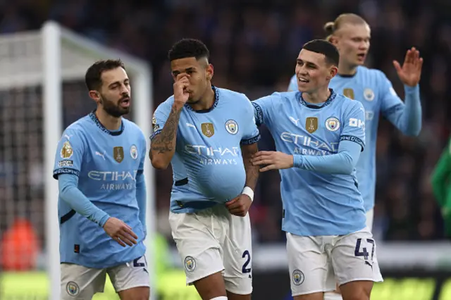 Savinho (2L) celebrates with teammates