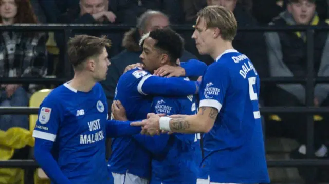 Cardiff players celebrate Callum Robinson's second goal at Watford