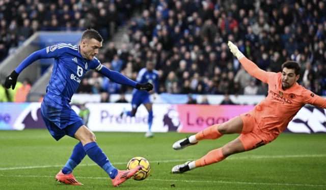 Manchester City's Stefan Ortega saves from Leicester City's Jamie Vardy