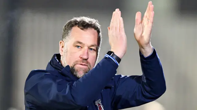 Manager David Artell of Grimsby Town applauds the fans