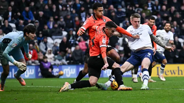 Preston striker Emil Riis scores from close range